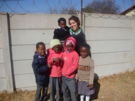 Mindra Kelly with Group of Children